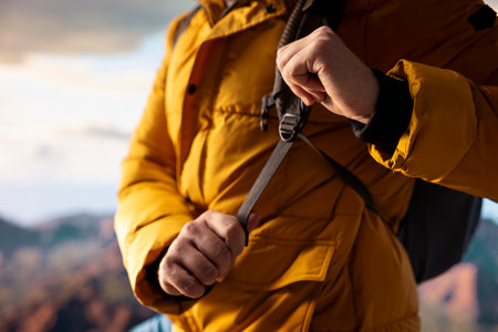 Young trekker embraces the challenge of mountain hiking with fresh air and epic view serving as a...
