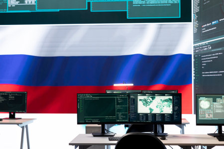 Governmental cyber operations room with Russian flag on big screen, focusing on information war and trolling. Highlighting the role of hackers in spreading disinformation and crowd control.の写真素材