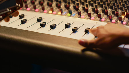 Skilled artist guitarist recording a new song with electro acoustic guitar, composing and editing...