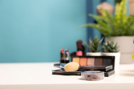 A minimalist beauty workspace with carefully placed skincare and makeup essentials, complemented by small plants. Ideal for digital marketing, online stores, and social media branding.の写真素材