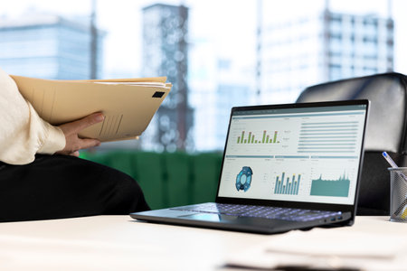 Empowered female CEO working in her high end corporate office, focusing on career development and maintaining a productive goal oriented work environment. Strategic thinking for growth. Close up.の写真素材