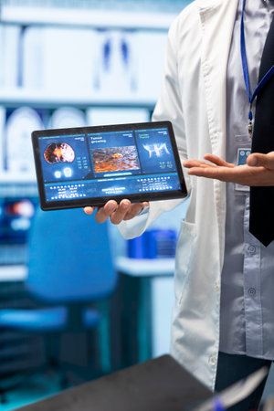 In a treatment center, healthcare professionals review mri scan test results and neurology x rays....