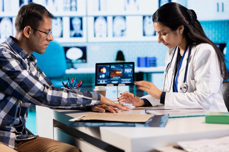 Healthcare professional uses an oximeter to measure the oxygen levels for a patient at check up,...
