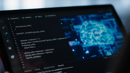 Data center technician using artificial intelligence on tablet to prevent vulnerabilities. Employee using device to review firewall rules, enforcing AI cybersecurity protocols, camera A close upの写真素材