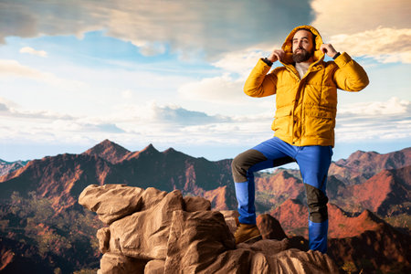 Nature lover stands at the edge of a breathtaking mountain range, looking at the scenic background...
