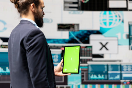 Male administrator using chroma key display for a digital analysis, ensures financial planning and...