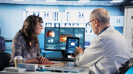Male general practitioner explaining preventative medicine and risk factors when it comes to cancer,...