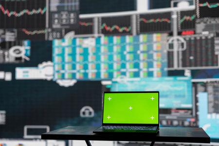 Isolated copy space screen running on laptop next to fintech annual reports, ensuring a strategy for...