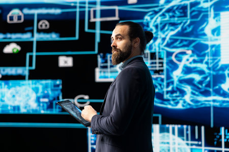 Young entrepreneur works on implementing AI brain system for deep learning, employing neural network and cybernetics for development. Driving smart technology and algorithmic thinking.の写真素材