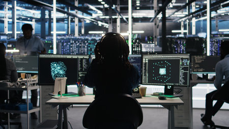Data center engineer using algorithms to analyze large datasets, putting on headphones. Server farm IT professional using artificial intelligence to recognize data patterns listening music, camera Aの写真素材