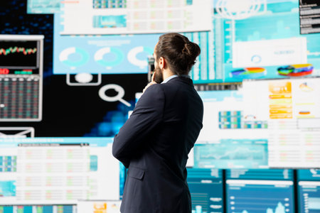 High end entrepreneur thinking about new powerful ideas for company profit growth, using analytics reports and KPI projections to guide his strategic decision making. Forecasting.の写真素材