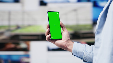 Male web user navigates phone with copy space for social media platforms, showcasing creativity and mobile technology to ensure online connection for entertaining activity. Camera A.の写真素材