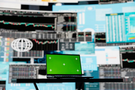 Laptop screen with a chroma key in empty space next to performance metrics, showcasing finance graphs and strategy tools to guide a new investment and decision making. Business growth.の写真素材