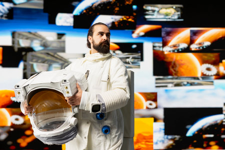 Modern man astronaut drifting in zero gravity during a space journey, reflecting interstellar adventure, celestial wonder and the future of astronautics and planetary discovery. Space craft.の写真素材