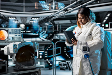 Astronaut studies mission plans before Mars expedition aimed at preparing for future of mankind. Crew prepares to explore planet surface in search of signs that could support human life beyond Earthの写真素材