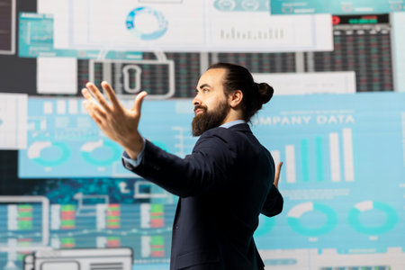 Optimistic motivated entrepreneur celebrating his success for business industry greatness, pleased with infographics and statistics. Powerful man achieving greatness as his legacy.の写真素材