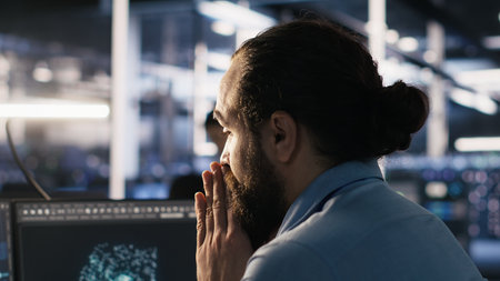 Exhausted computer scientist in server room reviewing neural network outputs, suffering from mental fatigue. Stressed data center IT expert analyzing AI LLM visualization, camera Aの写真素材