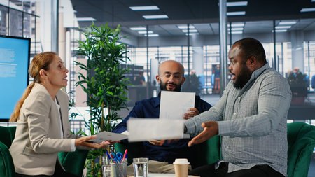 Corporate dispute involving powerful people during a briefing meeting, misunderstanding over strategic thinking. Disagreement due to frustration in a multicultural environment. Camera B.の写真素材