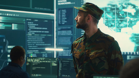 Government military hackers engaged in hybrid warfare strategies. Using sophisticated software and technology to secure information, prevent breaches and protect military operations. Camera A.の写真素材