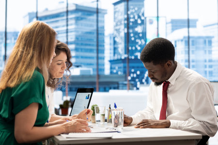 Teamworking employers tasked with hiring best talent to fill open company position, interviewing person. HR department colleagues hired to assess candidate skills and qualifications, doing meetingの写真素材