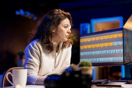 Photo editor retouching photographs with editing software on PC monitor, browsing through photoshoot...