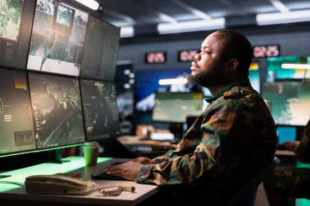 Air defense command operator using radar systems to detect incoming ballistic missiles. Army soldier in base of operations scanning rockets approaching borders, deploying shieldsの写真素材