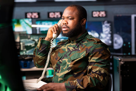 Military officer reporting battlefield information to army decision makers. Dispatcher coordinating clearances, tracking air traffic movement, giving informations to commandersの写真素材