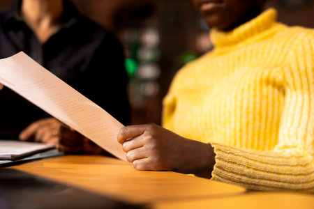 African american schoolgirl receiving personalized learning materials based on school curriculum,...