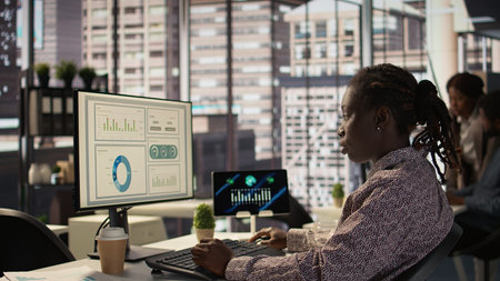 African american staff analyzing financial data for strategic planning, debating resource allocation for effective business operations. Analyst does financial forecasting and analysis.の写真素材