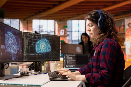 AI industry startup technician coding and listening music in office. Silicon Valley company employee...