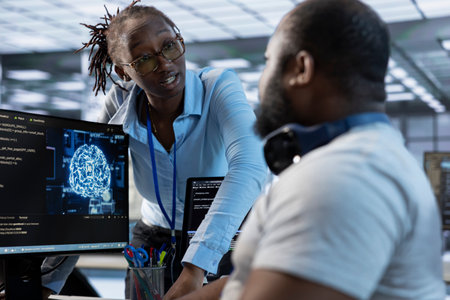 Manager discussing with AI programmer after making error in high tech data center. Supervisor...