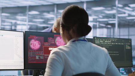 Woman seeing critical error on PC screen in data center, requesting help from cybersecurity team....