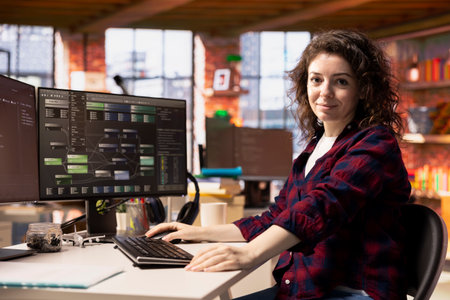 Portrait of smiling woman working in AI tech agency providing custom software development services....