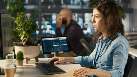 Office clerk at computer desk reading documentation files, solving tasks. Staff member analyzing...