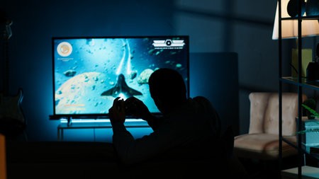African american focused person participates in online gaming battle, having fun with video games...