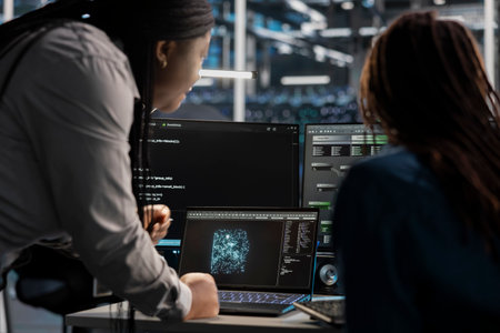 Data center engineering team using artificial intelligence visualization tools on device to identify...
