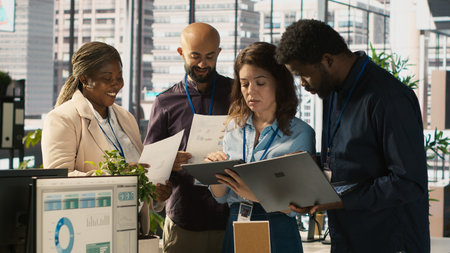 Coworkers in office doing brainstorming, reviewing financial charts, analyzing business performance...