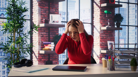 Furious disappointed woman ending the video call meeting by closing the pc, getting angry and...