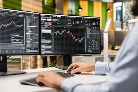 Day trader buys and sells stocks in prop firm office to capitalize on short term market...