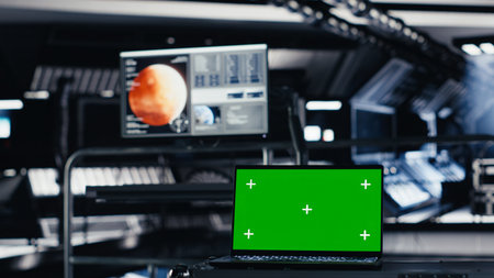 Mockup notebook used for orbital navigation data in cockpit during red planet journey. Green screen...