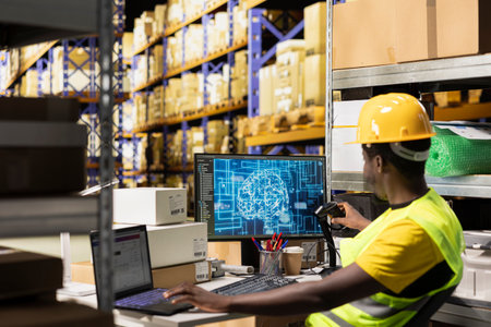 Employee uses AI brain automation to scan airway bill details on tags, registering barcodes with artificial intelligence machine learning system to fulfill e-commerce retail operations.の写真素材