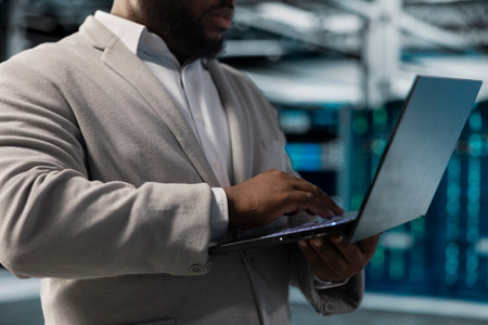 Close up of server hub worker running maintenance scans, fixing network issues affecting rigs...