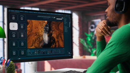 African American person uses AI chatbot to generate a video montage at home office, deep learning models and cloud technology for a personalized project, text to video. Camera A.の写真素材