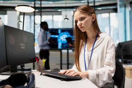 Female technician seeing critical error warning popup while adjusting deep learning algorithms...