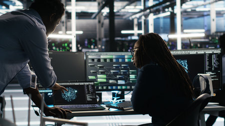Server hub team leader and worker using node tree software to optimize system health. Data center...