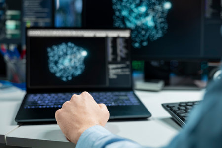 Close up of data center developer using laptop, monitoring AI systems, adjusting machine learning...