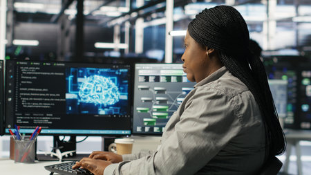 Data center employee deploying AI solutions optimizing equipment. Server farm software developer...