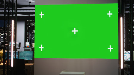 Empty business space showing dark office with isolated display late at night, digital display of graphs and performance metrics creating a strategic management progress.の写真素材