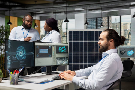 Engineer in office using artificial intelligence to design solar panel cells with reduced carbon footprint. RD expert uses AI deep learning to develop robotic arm systems for solar panel productionの写真素材