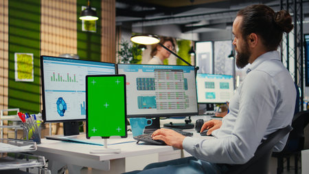 Male executive manager works with graphs and isolated mockup screen, ensuring business success for...